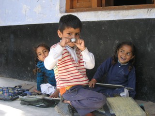 Boy on porch at Dharamkot school